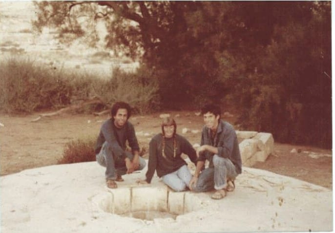 Photographed by Celia.  The young couple was impressed and announced on the spot that they were joining the initiative and coming with Doron to settle there.  The three commemorated the moment they sat by the water well in the grove at the foot of the settlement